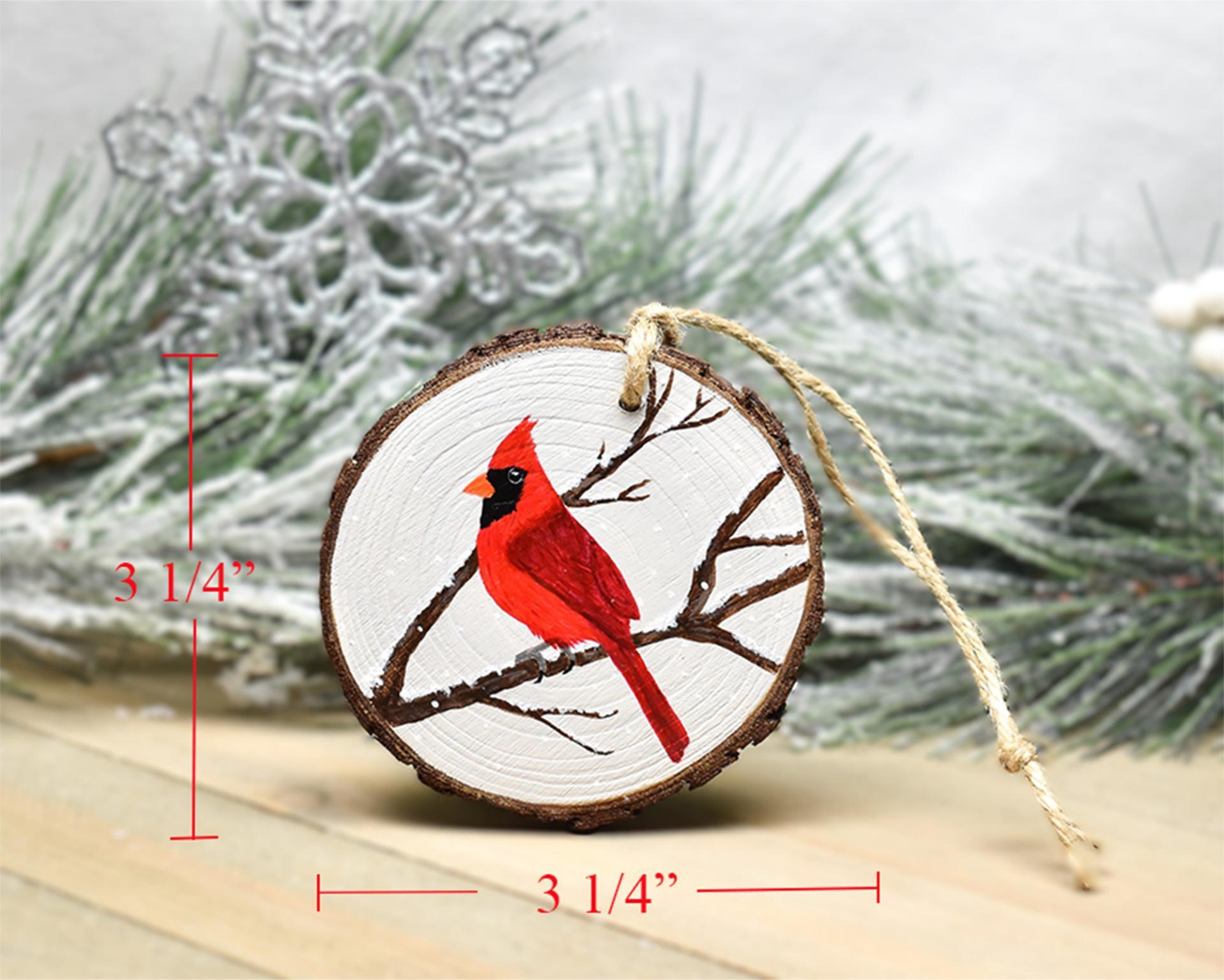 A handmade northern cardinal wood slice Christmas ornament with measurements displayed at Cove Creek Photography.
