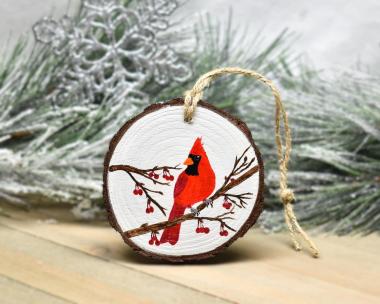 An acrylic painting of a male northern cardinal perched on a bare tree branch with red berries at covecreekphotography.com.