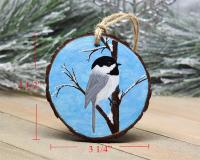 A hand-painted chickadee wood slice ornament with measurements at Cove Creek Photography.