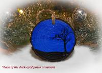 A hand-painted starry night with silhouettes of a tree and birds on a wood slice ornament at covecreekphotography.com.