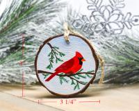 A handmade wood slice ornament with measurements displayed along the ornament at covecreekphotography.com.