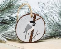 A hand-painted chickadee wood slice ornament available at Cove Creek Photography.
