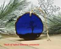 A hand-painted scene of a starry night sky with a silhouette of a tree and birds hand-painted on a wood slice ornament at covecreekphotography.com,