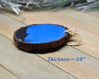 An image displaying the thickness of a handmade common loon Christmas ornament at covecreekphotography.com.