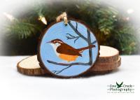 A Carolina wren hand-painted on a wood slice at covecreekphotography.com.