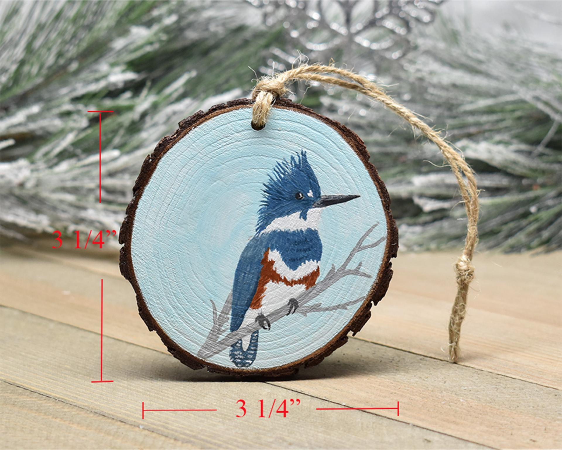 A hand-painted belted kingfisher Christmas ornament with wood slice measurements along each side at Cove Creek Photography.